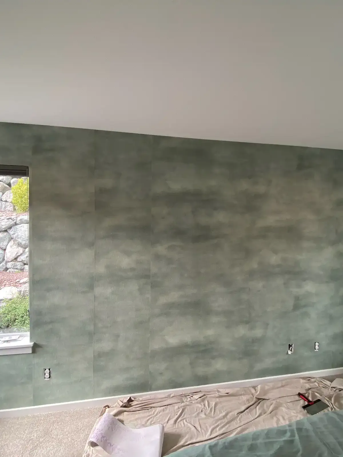 Professional wallpaper installer from Signature Wallpaper Solutions at work